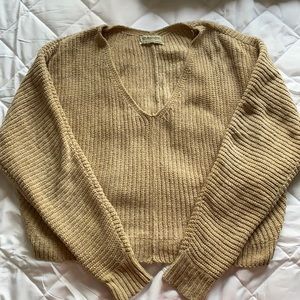 Urban outfitters light gold/tan cropped v neck sweater great for the holidays!